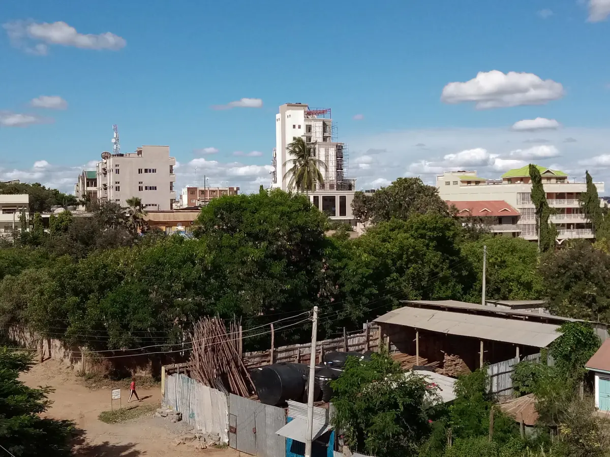 Skyline of Voi town with trees and buildings under a bright sky